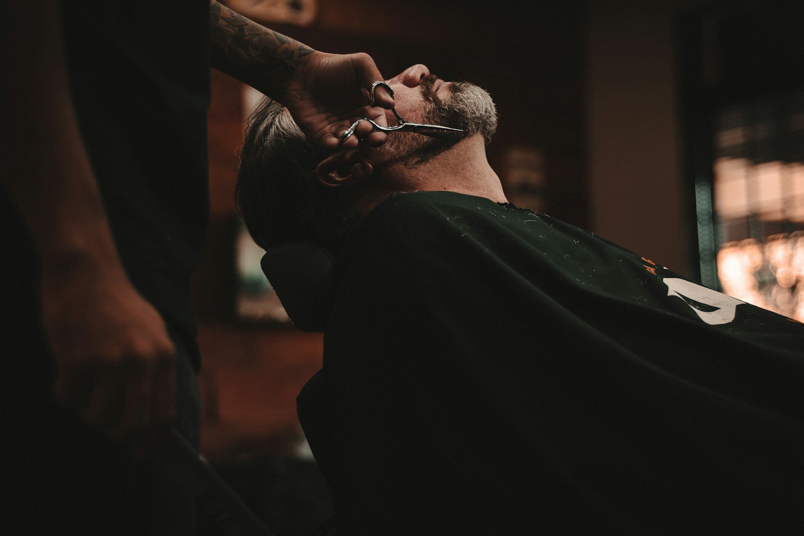 Barber working on a haircut; stock inspiration photo by Allef Vinicius